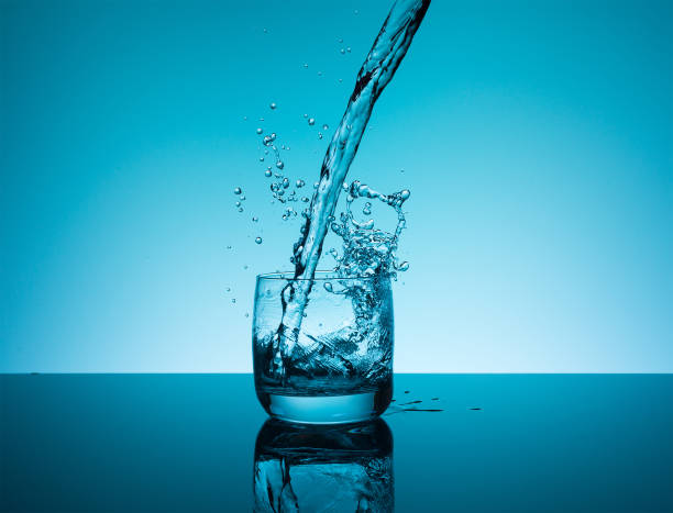 istock Creative splashing water in the glass 688575692