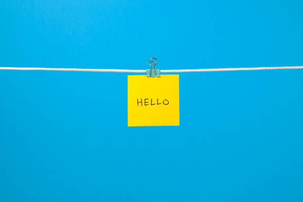 istock Yellow paper sheet on the string with text 