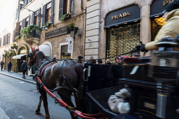 Rome: Carriage with horse carrying tourists on Via Condotti  in Rome, Italy, one of the most exclusives streets in Europe