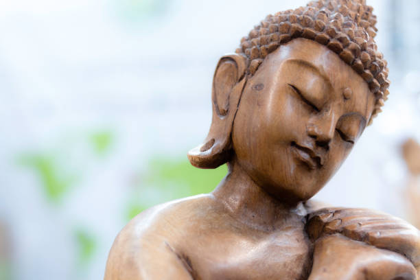 istock Meditation and relaxation with Buddha statue 688582676
