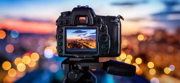 Digital camera Digital camera on the background of the evening city video still photos stock pictures, royalty-free photos & images