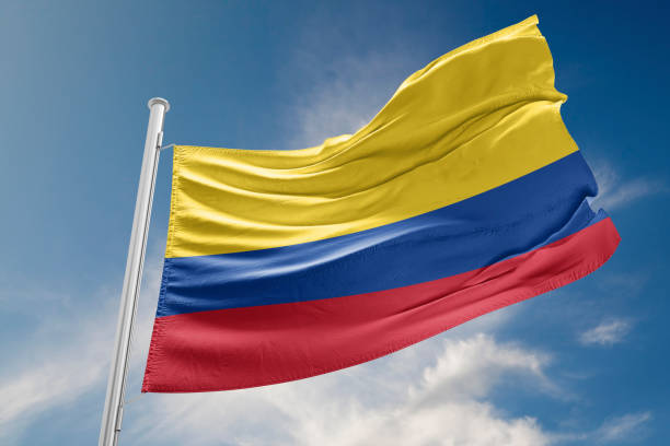 Colombia flag is waving at a beautiful and peaceful sky in day time while sun is shining. 3D Rendering