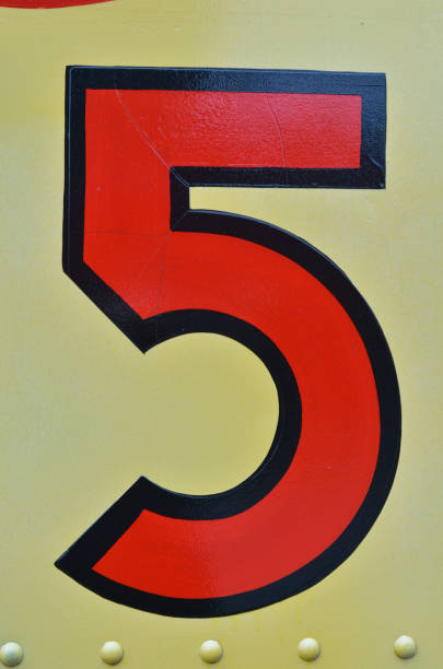 istock vintage handpainted number five painted red outlined in black line on yellow 688582828