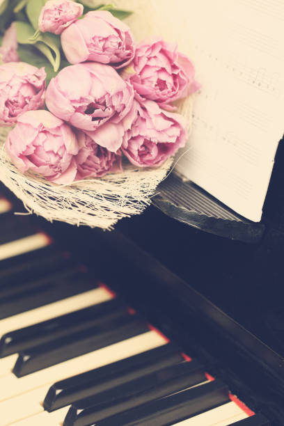 istock Romantic blossom background with flowers and music 688587358