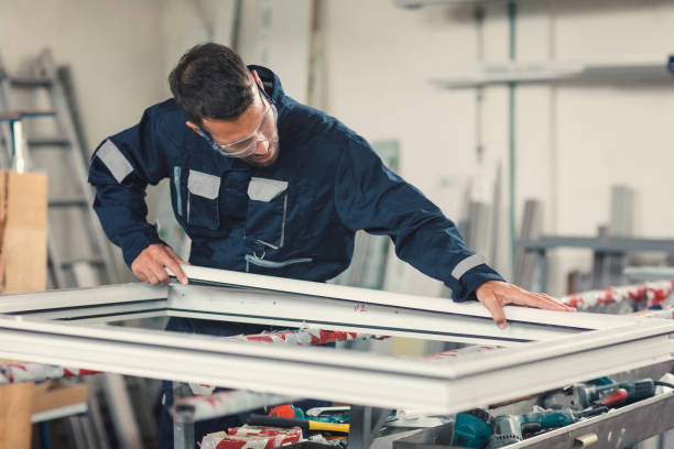 Aluminium and PVC industry worker Aluminium and PVC industry worker making PVC or aluminium frames for windows and doors pvc stock pictures, royalty-free photos & images