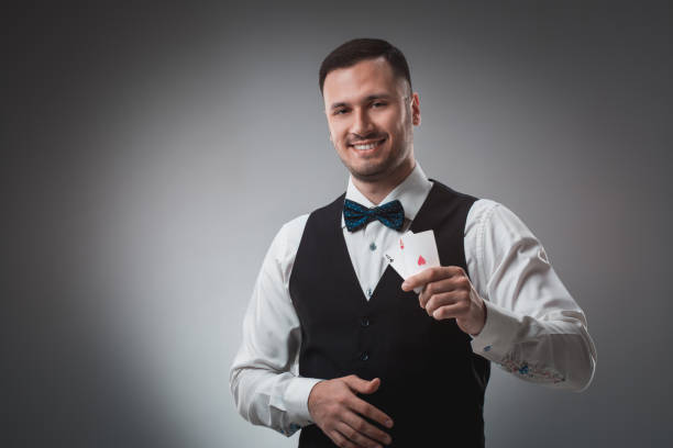 istock Handsome confident man holding cards looking at camera 688588778