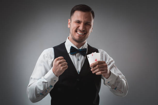istock Handsome confident man holding cards looking at camera 688588918