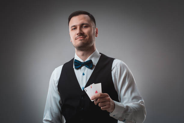 istock Handsome confident man holding cards looking at camera 688589136