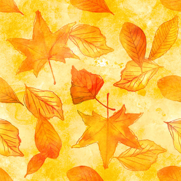 istock Seamless pattern of watercolor autumn leaves on golden 688591096