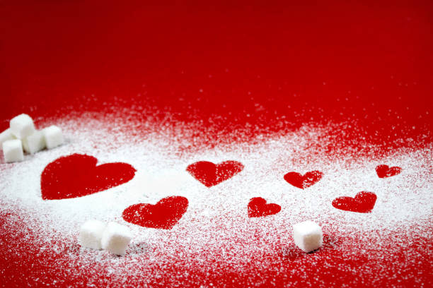 istock Hearts of sugar on red background 688591626