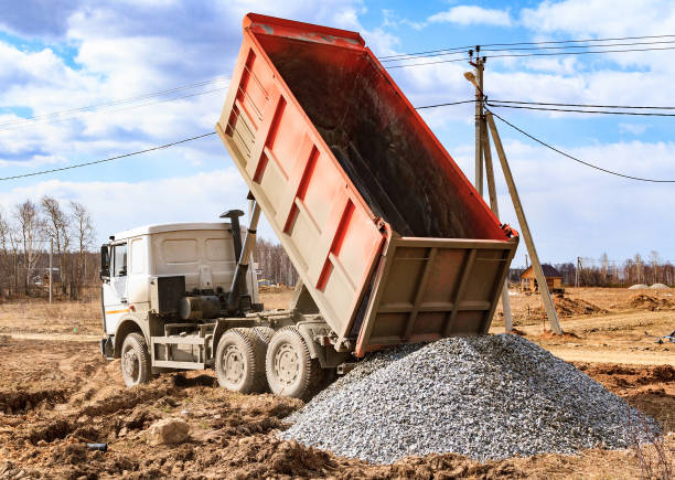 Dumptruck in action Dumptruck in action on a construction site gravel photos stock pictures, royalty-free photos & images