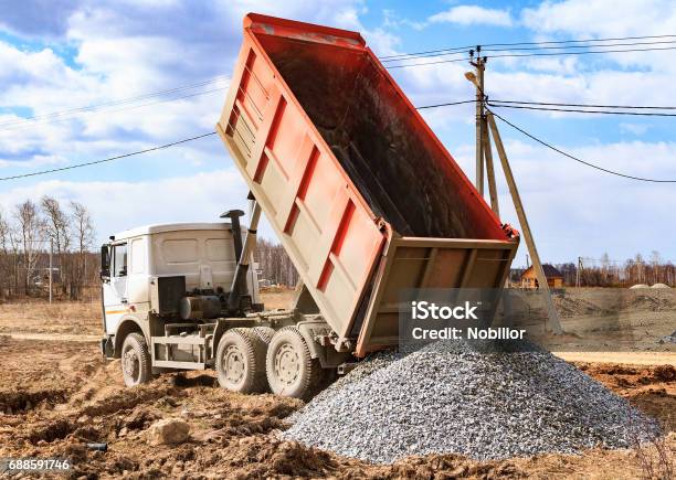Dumptruck In Action Stock Photo - Download Image Now - Transportation, Gravel, Sand