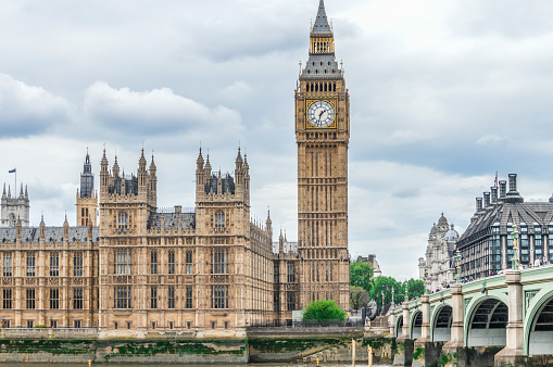 London, United Kingdom - May 22 2022: Westminster tube station with the Elisabeth tower and Big Ben in the background