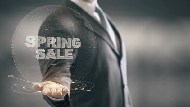 istock Spring Sale Businessman Holding in Hand New technologies 688592342