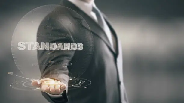 Photo of Standards Businessman Holding in Hand New technologies