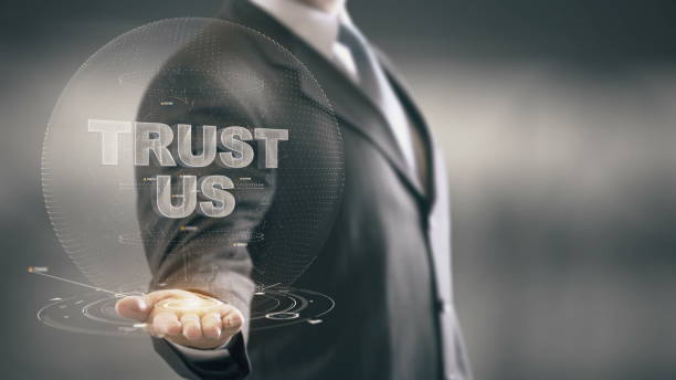 istock Trust Us Businessman Holding in Hand New technologies 688592956