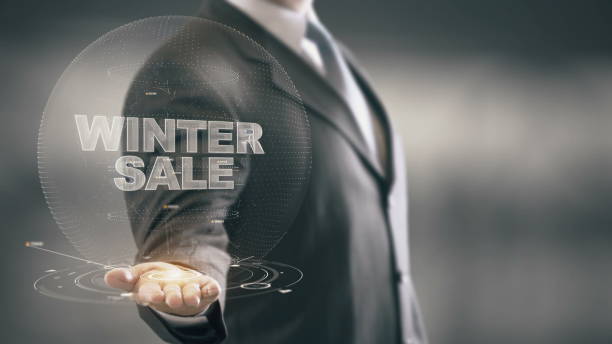 istock Winter Sale Businessman Holding in Hand New technologies 688593124