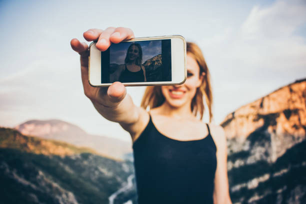 istock Beautiful girl taking a selfie 688593556