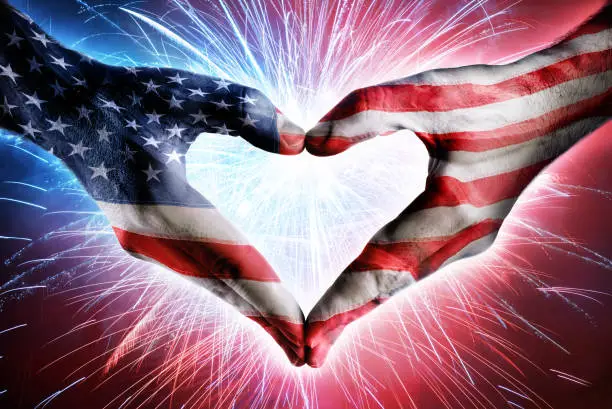 Usa Flag On Heart Shaped Hands And Fireworks