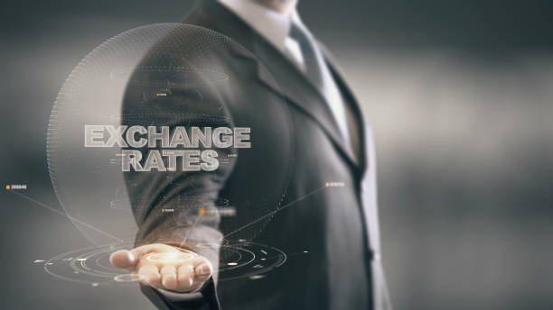 istock Exchange Rates with hologram businessman concept 688595020
