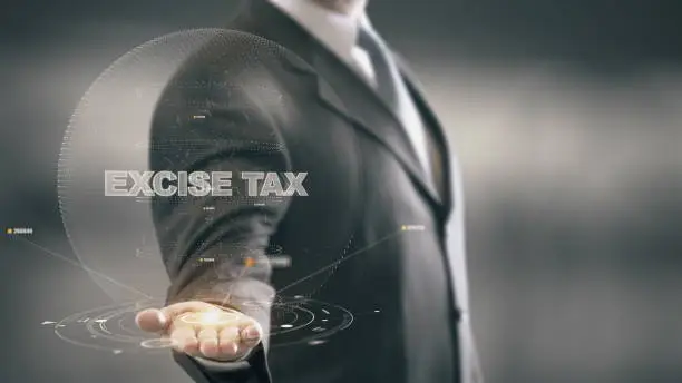 Photo of Excise Tax with hologram businessman concept