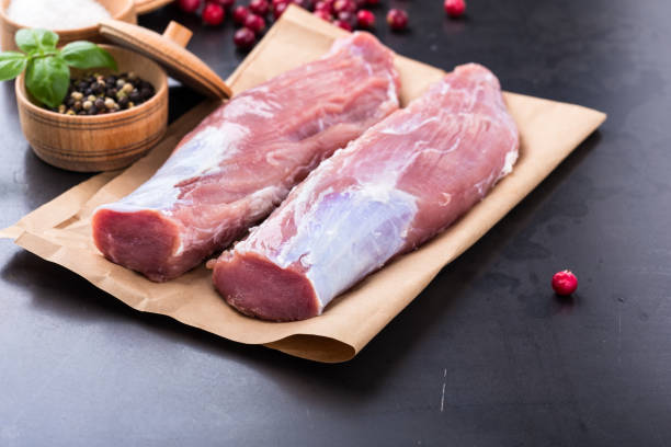 raw pork tenderloin on craft pape - beef sirloin steak raw loin imagens e fotografias de stock