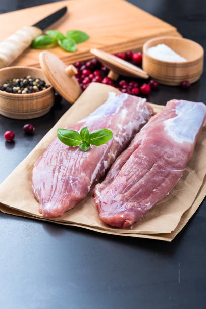 istock Raw pork tenderloin on craft pape 688595814