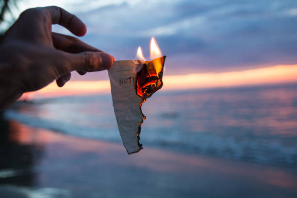 Burning piece of paper with words Nothing stock photo