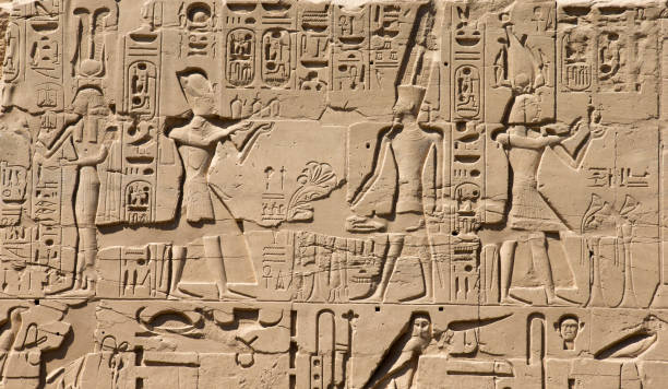istock old egypt hieroglyphs carved on the stone 688598382