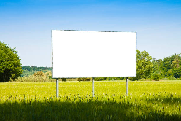 istock A blank advertising billboard in a grass field - image with copy space 688598684