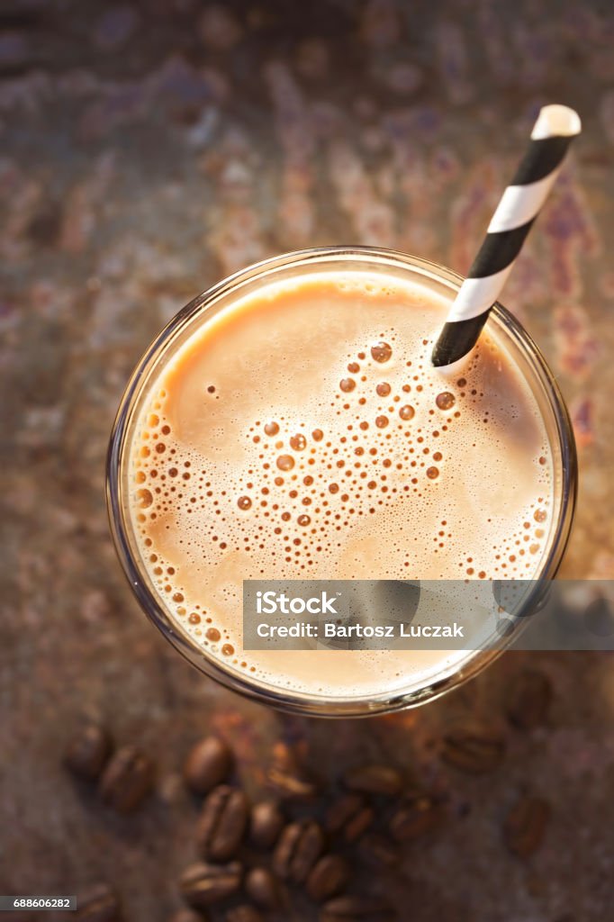 Iced coffee with black and white striped straw Milkshake Stock Photo