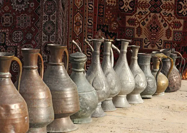 showcase with souvenirs, old  pitchers and teapots, Uzbekistan