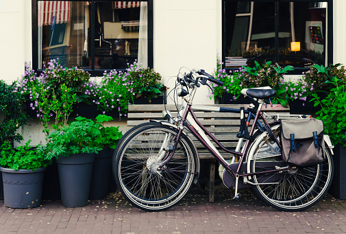Two bicycles staying on a picturesque street in Amsterdam