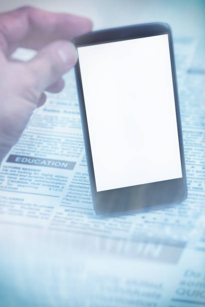 istock fake newspaper and smartphone 688665306