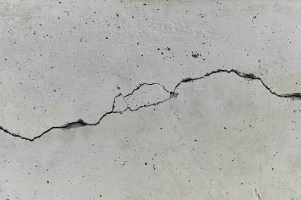 istock cracked concrete wall with long fissure 688714300