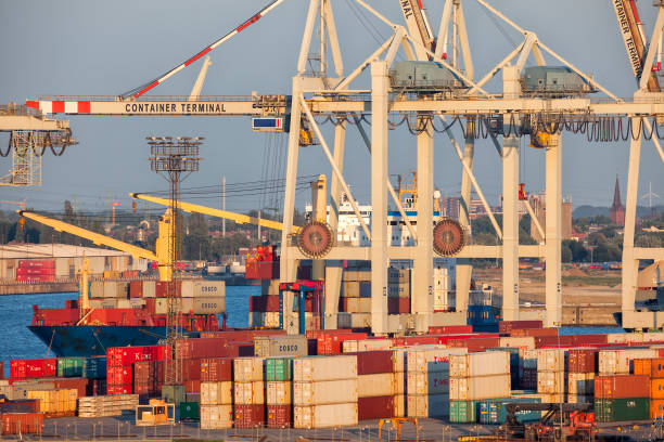 istock Container Ship Being Unloaded at Sunset, Hamburg Harbor, Germany 688718980