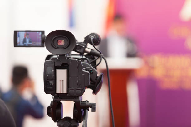 istock Filming an media event with a video camera. Press conference. 688724504