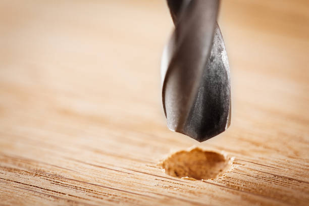 istock metal drill bit make holes in wooden oaks plank 688727686
