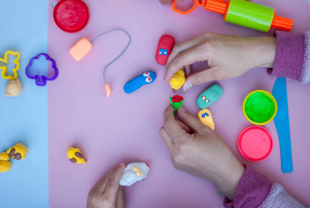 istock hands playing with plasticine toys 688729826
