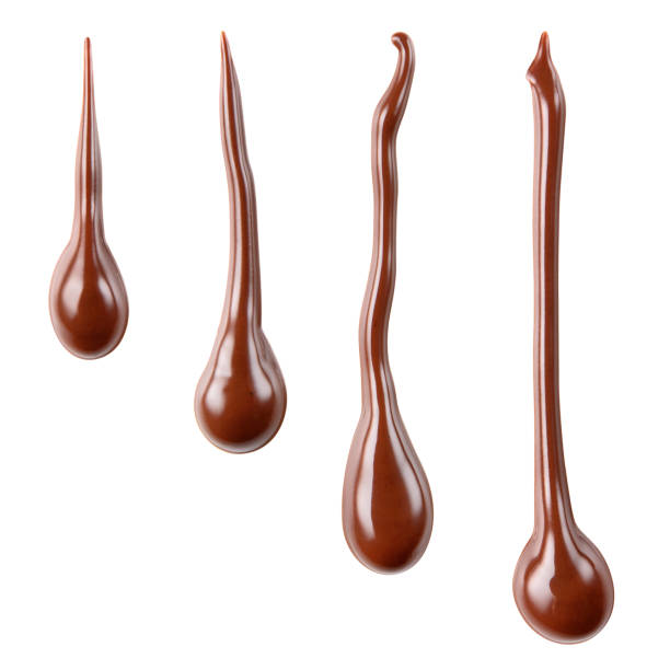 istock Melted hot chocolate syrup is dripping. Streams with drops isolated on white. With clipping path. 688729978