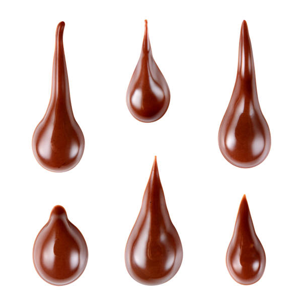 istock Melted hot chocolate syrup is dripping. Streams with drops isolated on white. With clipping path. 688730086
