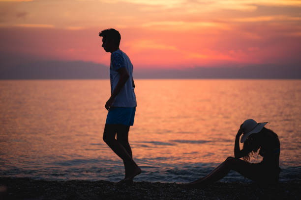 istock Couple silhouette breaking up a relation on the beach at sunset 688733292
