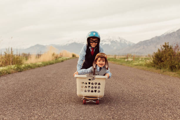 istock Two Young Business Boys Racing on Skateboard 688733426
