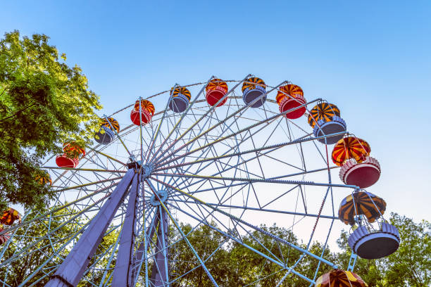 istock Classic Ferris wheel. Entertainment Park attraction with retro booths. 688733600