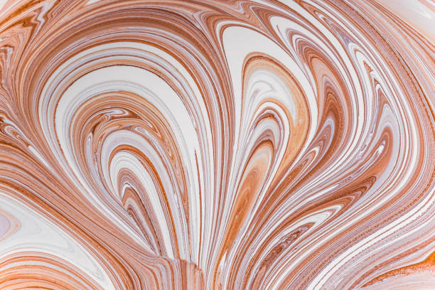 istock Mixing brown color scheme with a bright white interior with acrylic paint. Mixing liquid paint. Abstract texture, wavy curls. 688733832