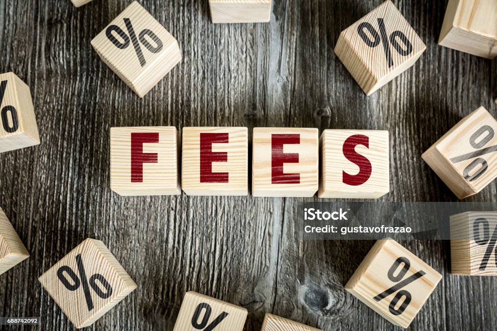 Fees sign Wooden Blocks with the text: Fees Fee Stock Photo