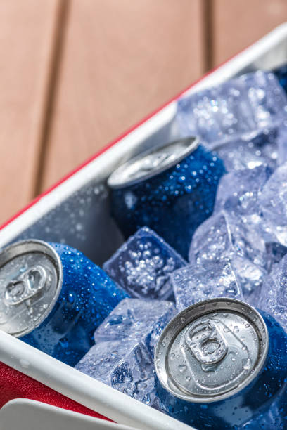 istock Close-up of a cooler full of ice cold drinks cans 688745488