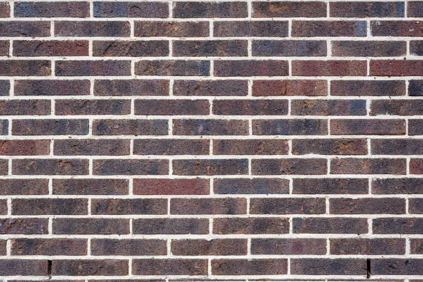 istock Background and texture of dark brown brick wall surface. 688745664