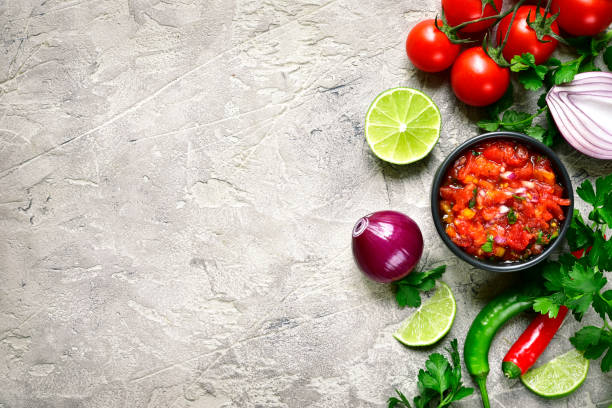 Ingredients for making tomato salsa (salsa roja) - traditional mexican sauce