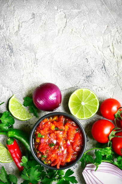 istock Ingredients for making tomato salsa (salsa roja) - traditional mexican sauce 688754196